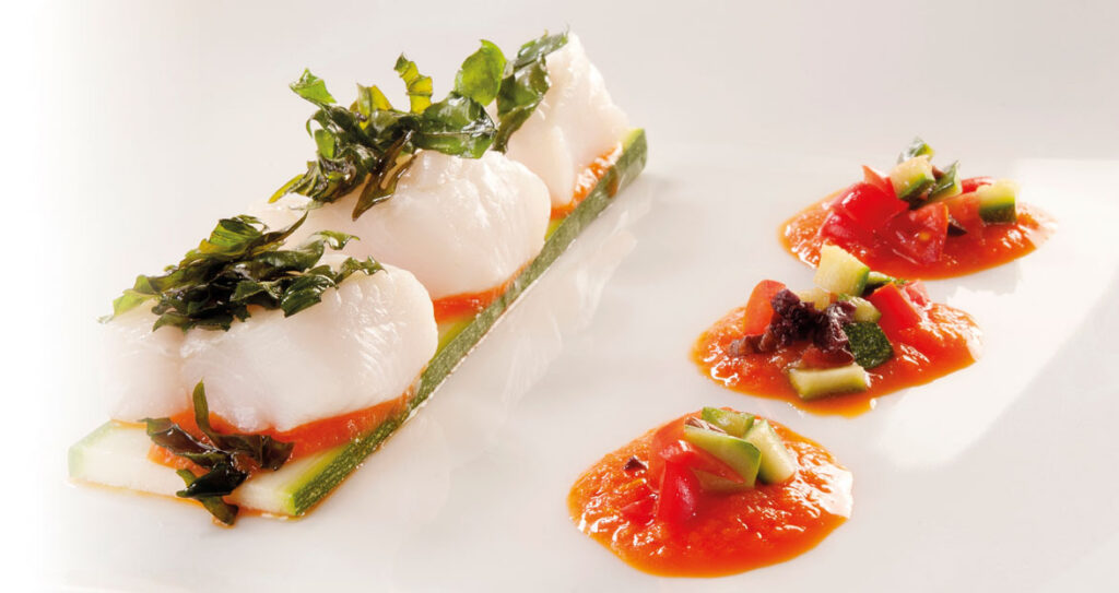 Bocconcini di dentici su crema di peperoni al profumo di Aceto Balsamico di Modena IGP
